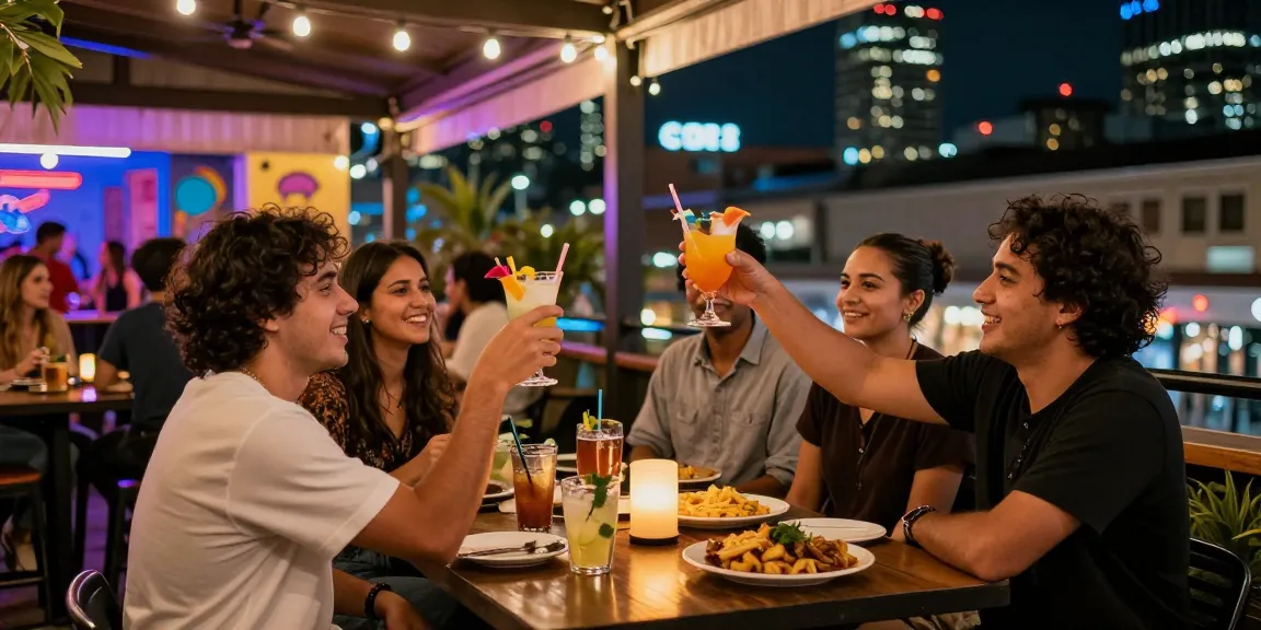 Discover vibrant 유흥사이트 nightlife with friends enjoying cocktails in a lively urban bar scene.